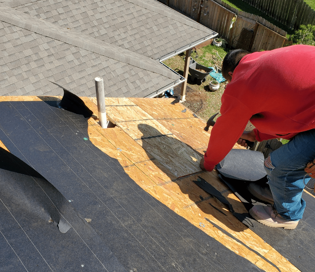Roofer installing a new shingle roof on a Richmond, Texas home
