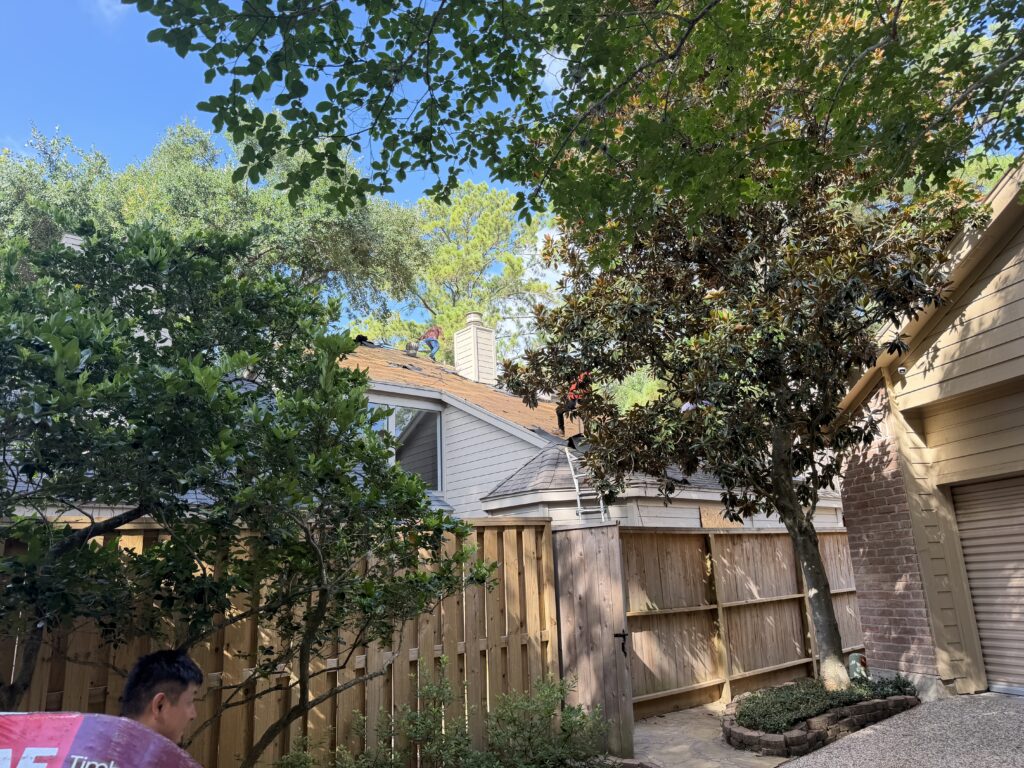 Roof repair in Sienna Missouri City - two-story brick home