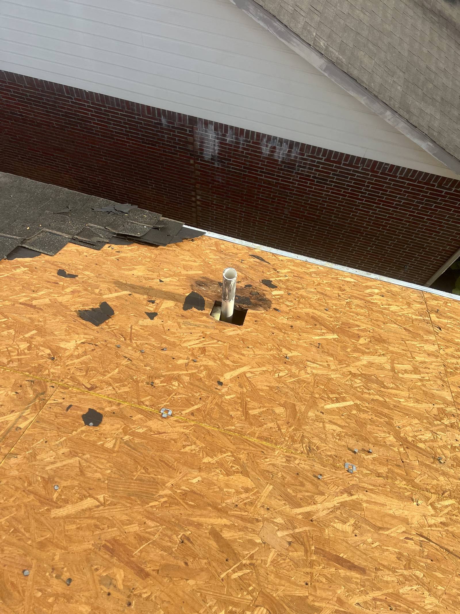 Tear-off complete with bare deck before replacement in Sugar Land
