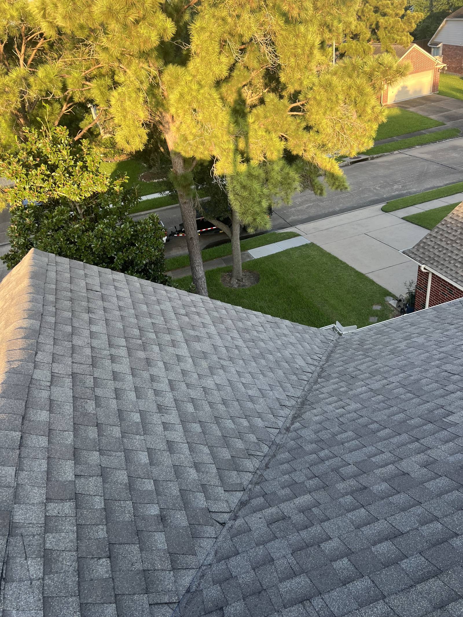 Finished valley detail after roof replacement in Sugar Land