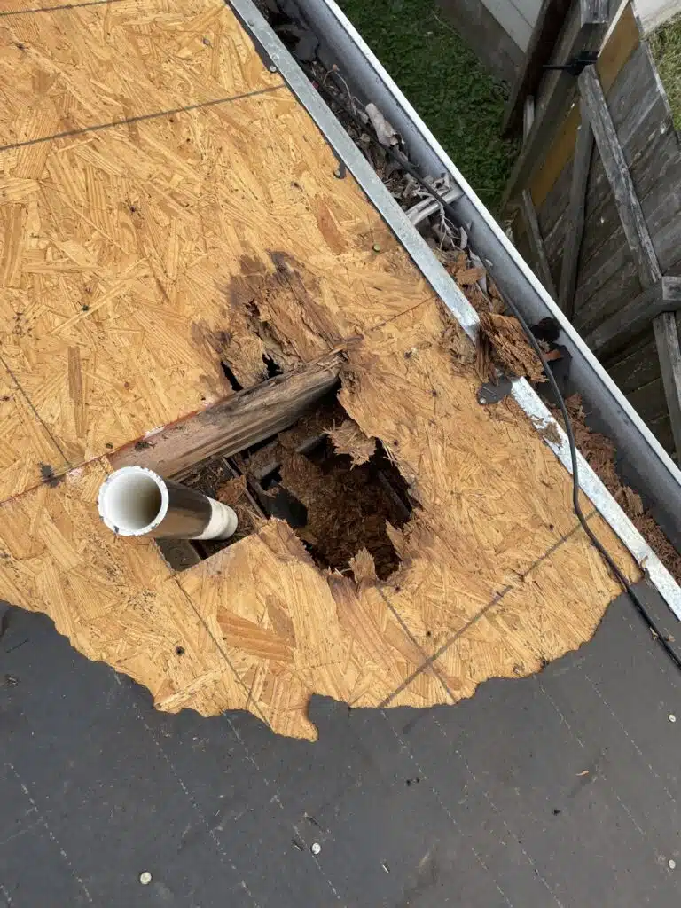 Rotted roof decking found under the storm-damaged roof in Sienna, Missouri City