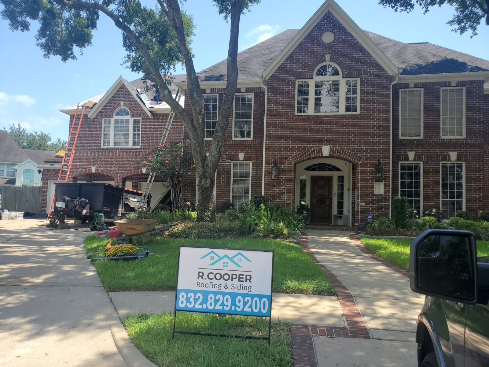 R. Cooper Roofing and Siding crew working on a Texas home