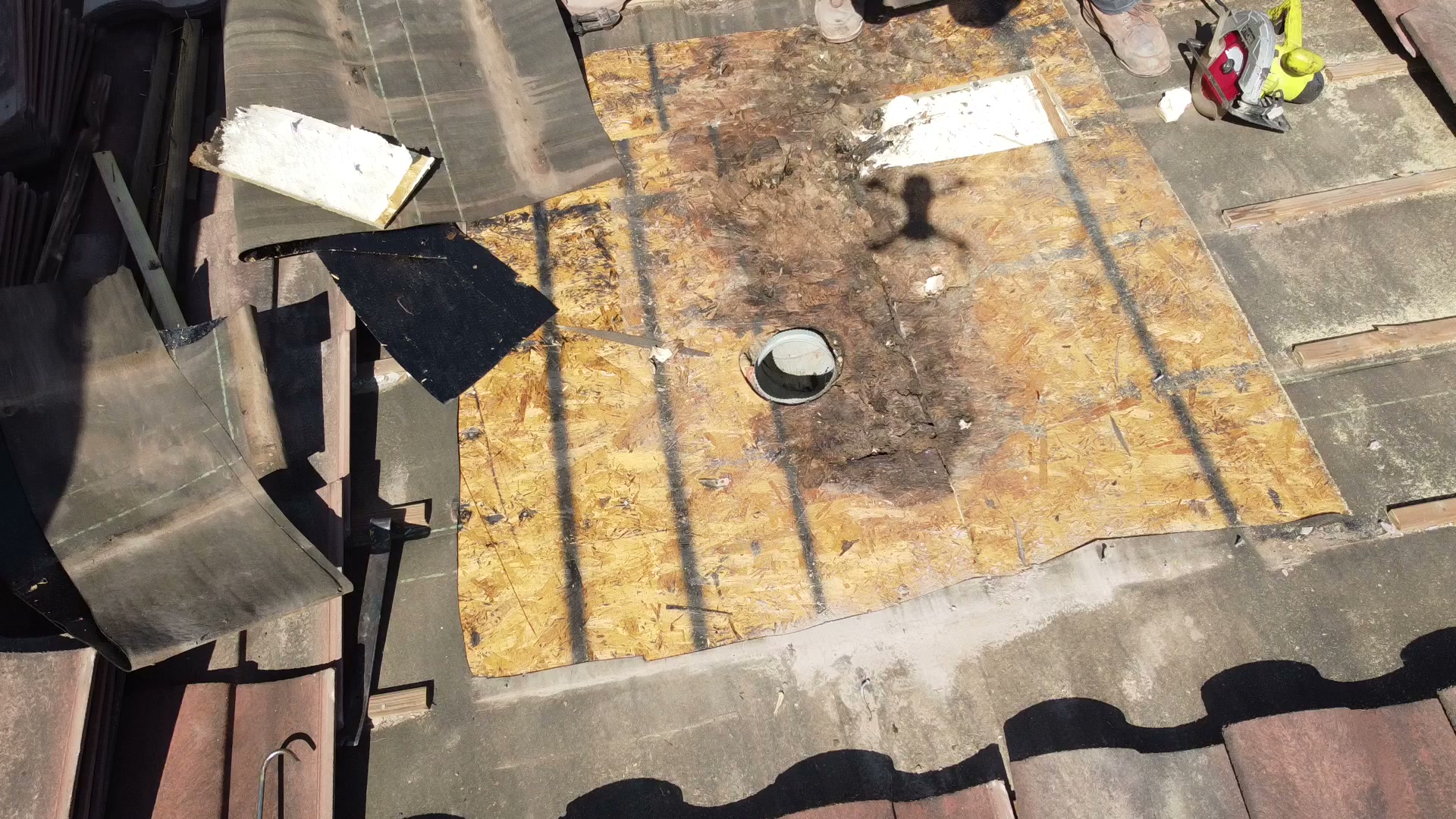 Rotted decking around the vent pipe, the source of the leak. Riverstone, Missouri City, October 2026.