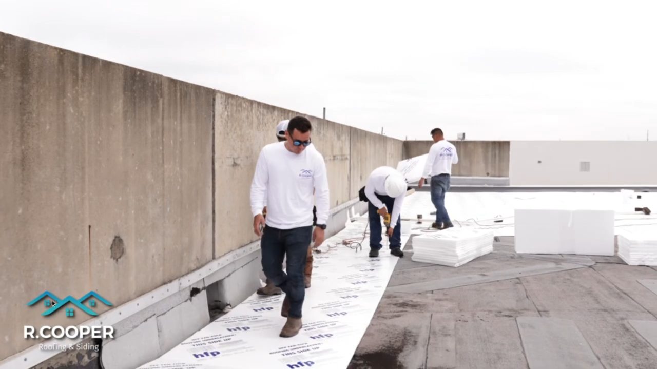 TPO membrane installation over insulation on a Fort Bend County commercial roof