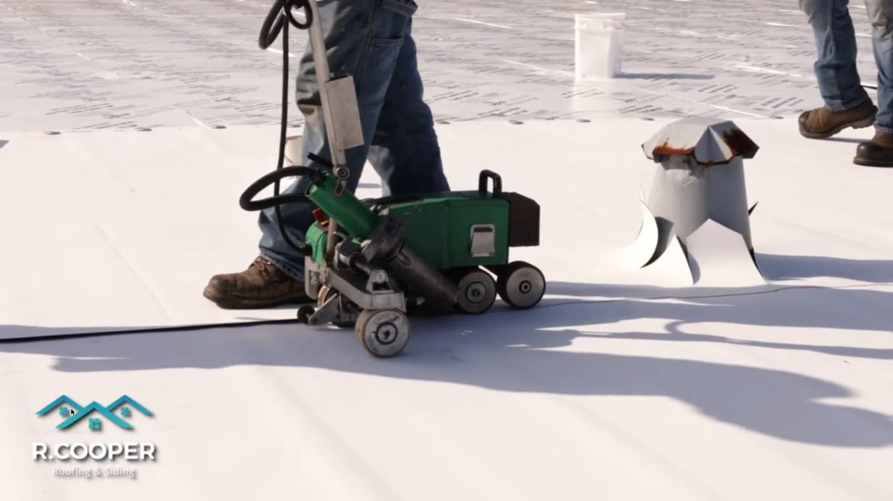 Heat welding TPO roof seams with a hot air welder, Stafford TX